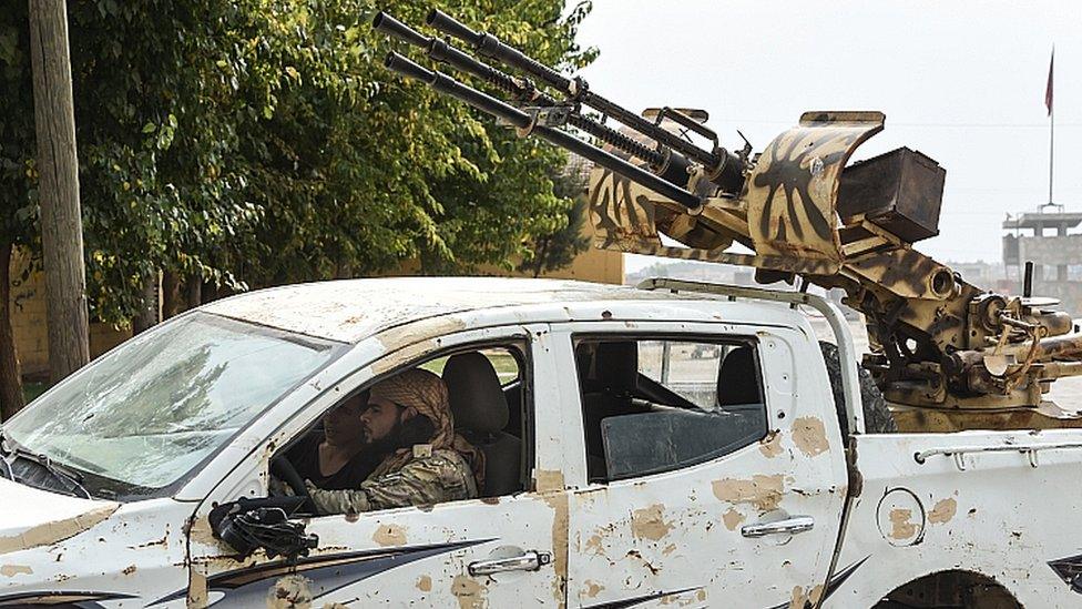 Vehicles carrying the members of Turkish-backed Free Syrian Army drive near the border on October 19, 2019 in Akcakale, Turkey