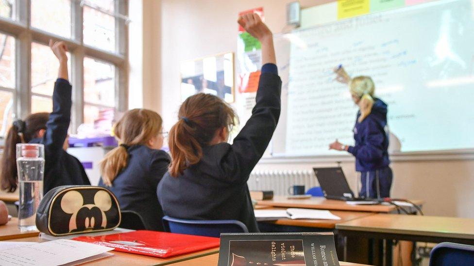 File photo dated 12/09/18 of a teacher and students in a classroom. Only one in 10 state schools say all their pupils are studying a language at GCSE level, compared with nearly a third of private schools, a report suggests.