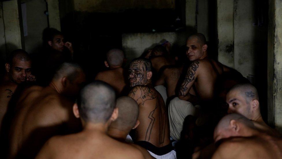 Members of Barrio 18 gang remain in a cell at the Penitentiary Complex in Izalco, El Salvador, 27 April 2020