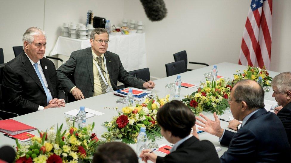 Rex Tillerson (L) meets Sergey Lavrov (second right)