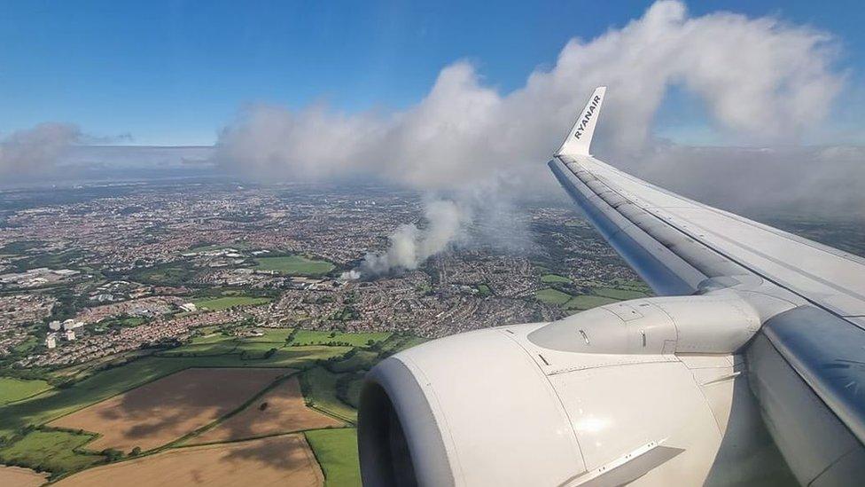 The view of the smoke from inside a plane that had taken off from Bristol Airport