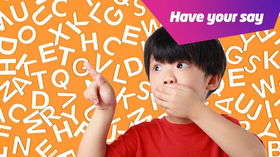 boy-covering-mouth-with-letters-in-the-background.