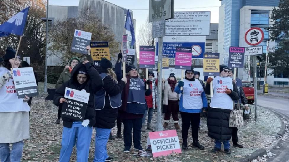 Members of the RCN on the picket line outside the University Hospital Wales in Cardiff