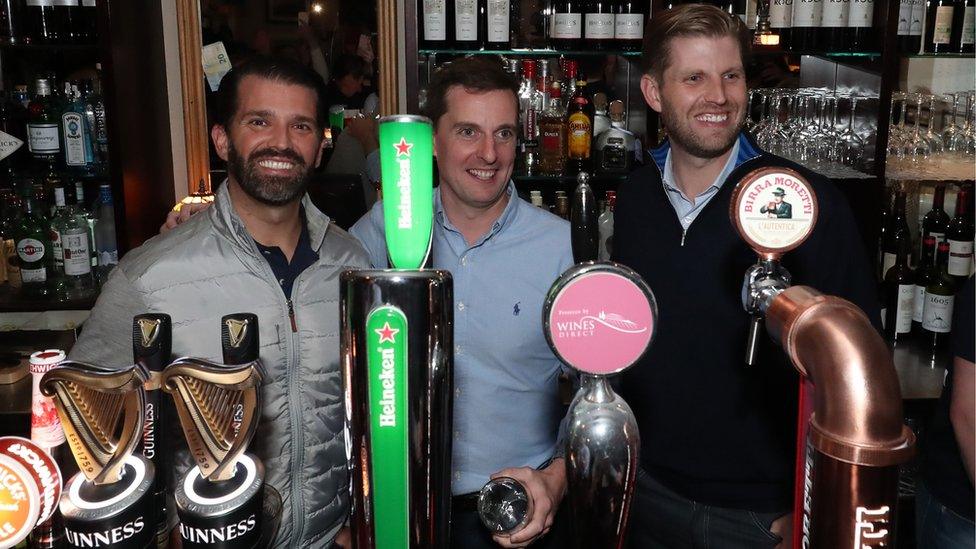 Donald Trump's sons, Donald Jr (left), and Eric Trump (right), got behind the bar in Doonbeg