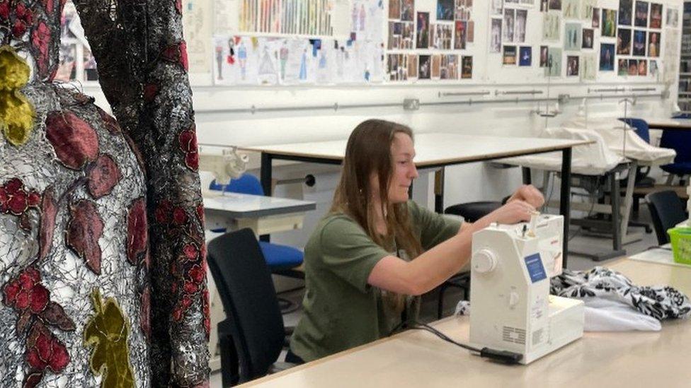 Sophie Reed working with her sewing machine