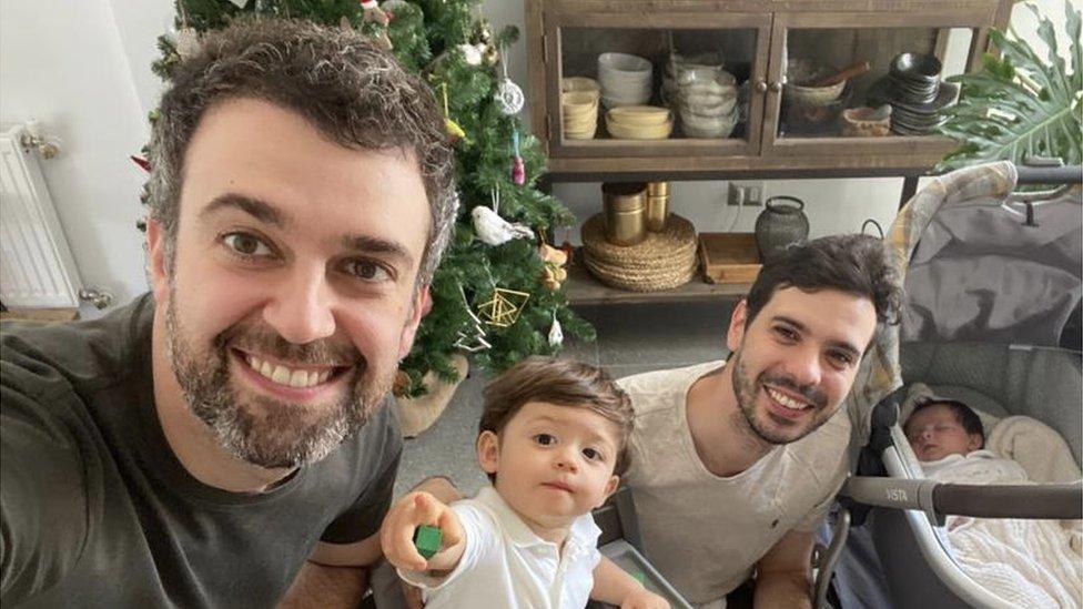 Photo shows Javier Silva and his partner Jaime with their children