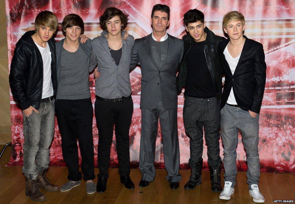 One Direction with manager Simon Cowell