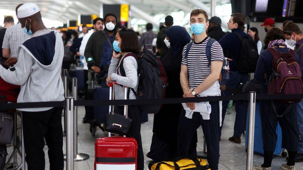 People queueing at Heathrow Airport