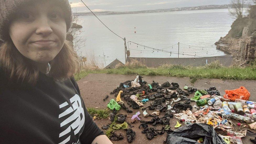 Hannah Beaumont standing in front of the rubbish she collected