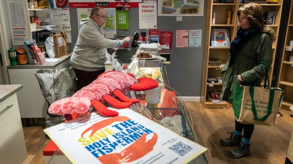 A "Save the Holy Island Fishermen" leaflet in the post office on Lindisfarne