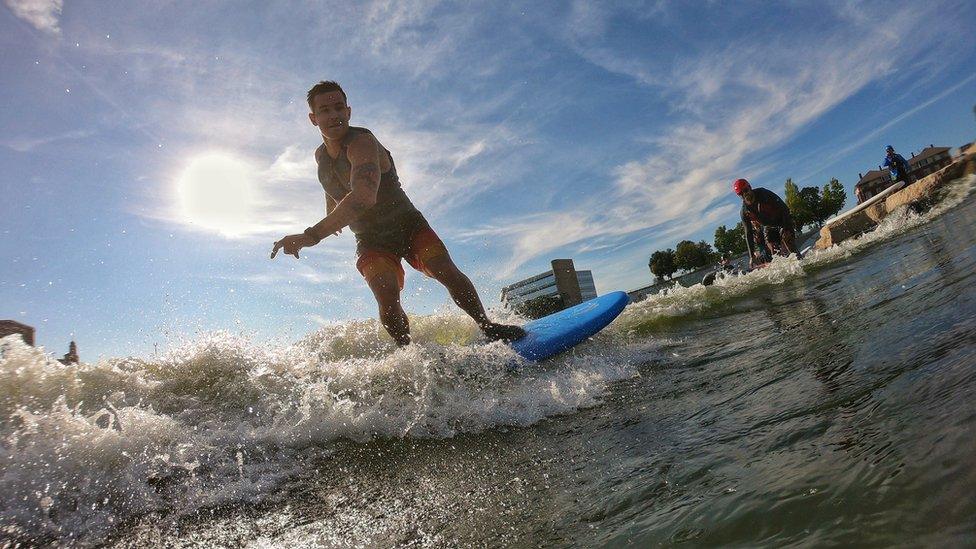 Jake Brown shredding a wave on the Great Miami River in Ohio