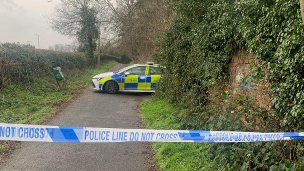 A police care at Oakwood Pond in Harlow