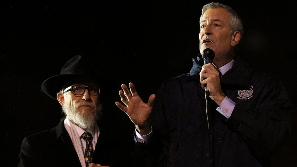 New York City Mayor Bill de Blasio (R) talks at Grand Army Plaza in solidarity with the victims of a stabbing at an Hasidic rabbi's home in Monsey, on December 28, 2019