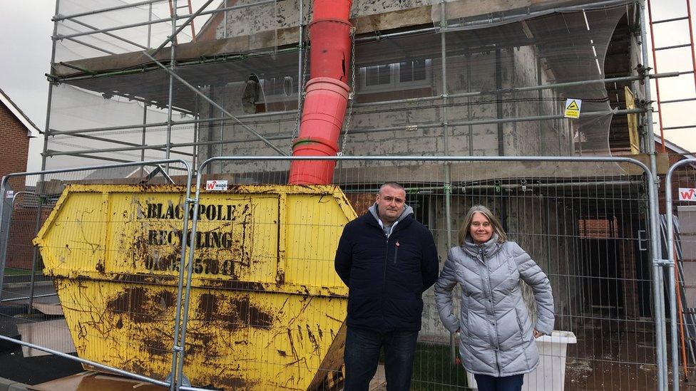 Craig and his partner Tracey by their house