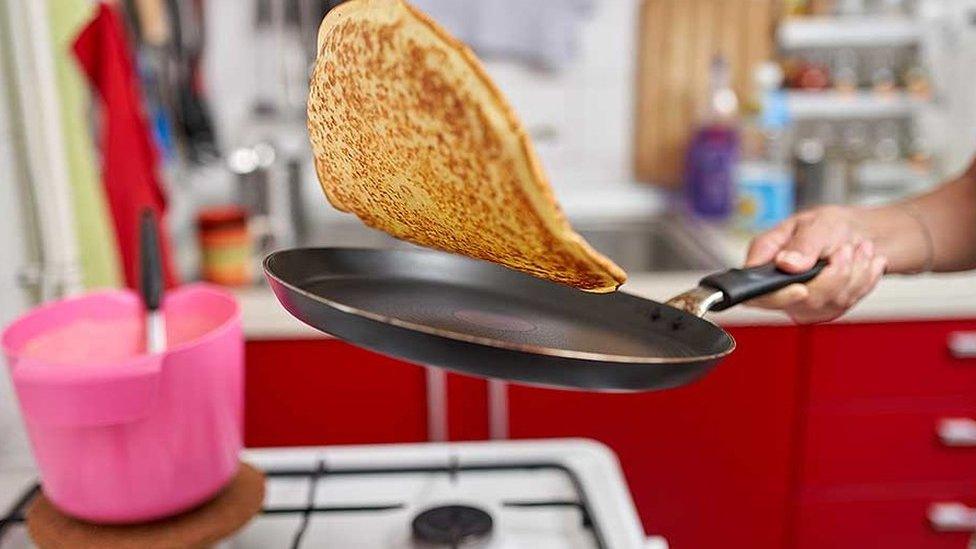 Pancake cooking in frying pan