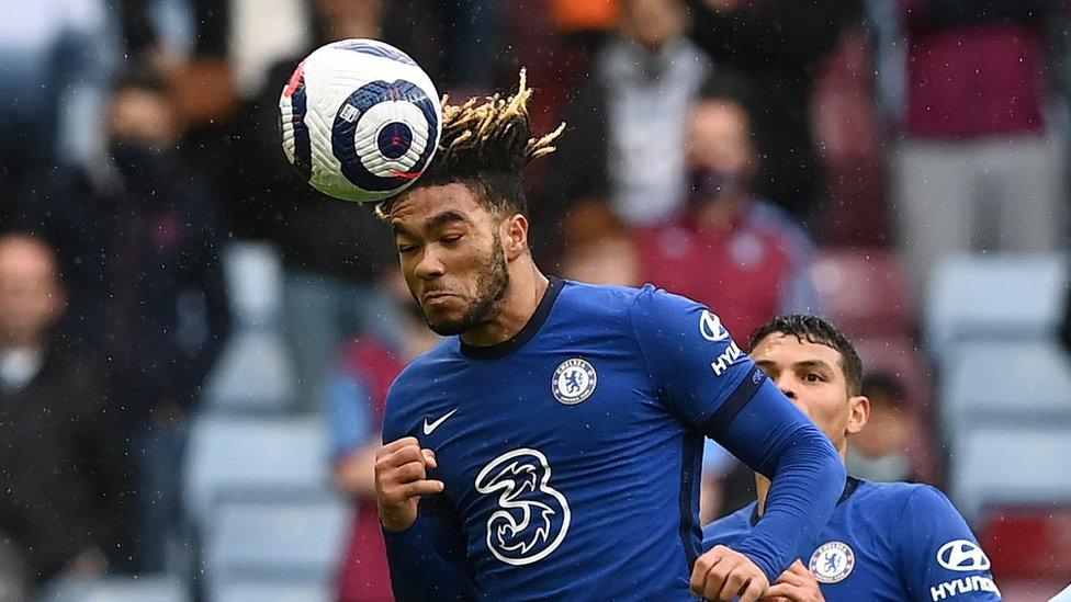 Chelsea player Reece James heading the ball