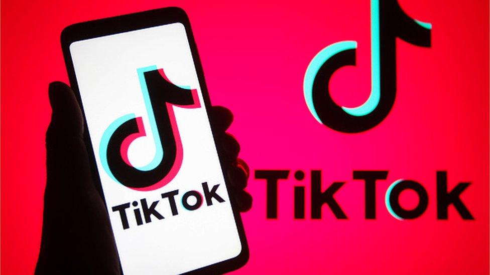 TikTok logo on a phone