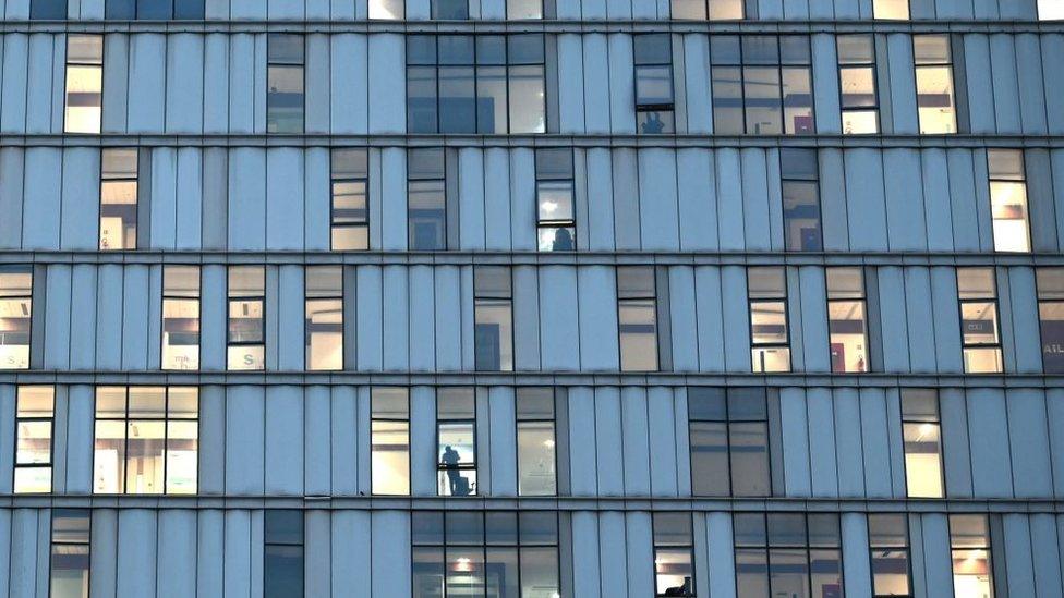 An employee (C) of a private Information Technology (IT) firm is seen in an office building after the state government announced a lockdown to curb the spread of Covid -19 coronavirus in Kolkata on June 2, 2021.