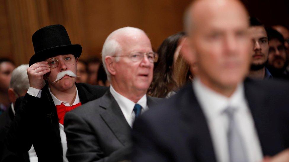 Amanda Werner protests Richard Smith's appearance at the US House Energy and Commerce Committee