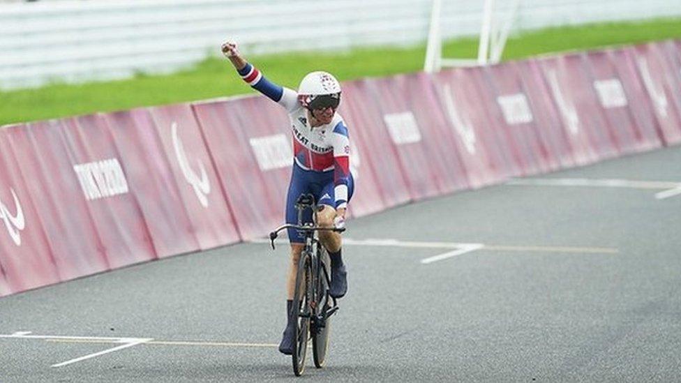 Sarah Storey celebrates after crossing the line