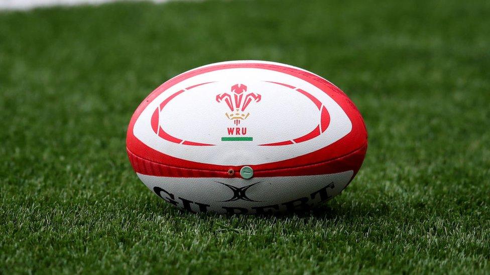 Rugby ball bearing the WRU logo