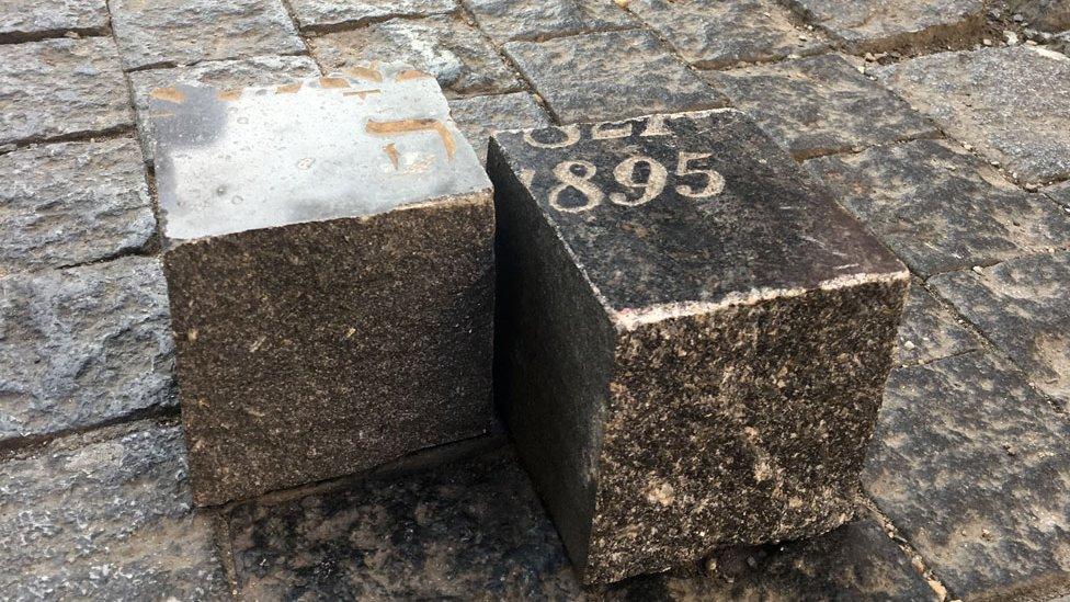 Prague cobblestones made of gravestones cut into squares