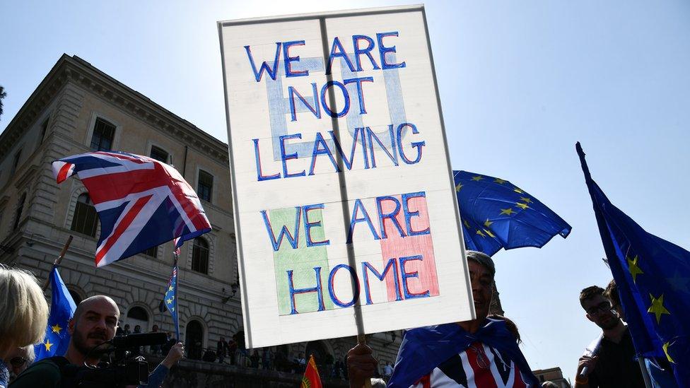 A man protests against 'Brexit' and holds a placard reading 'we will always be European' during a pro-Europe demonstration (European federalist movement) on March 25, 2017 in Rome