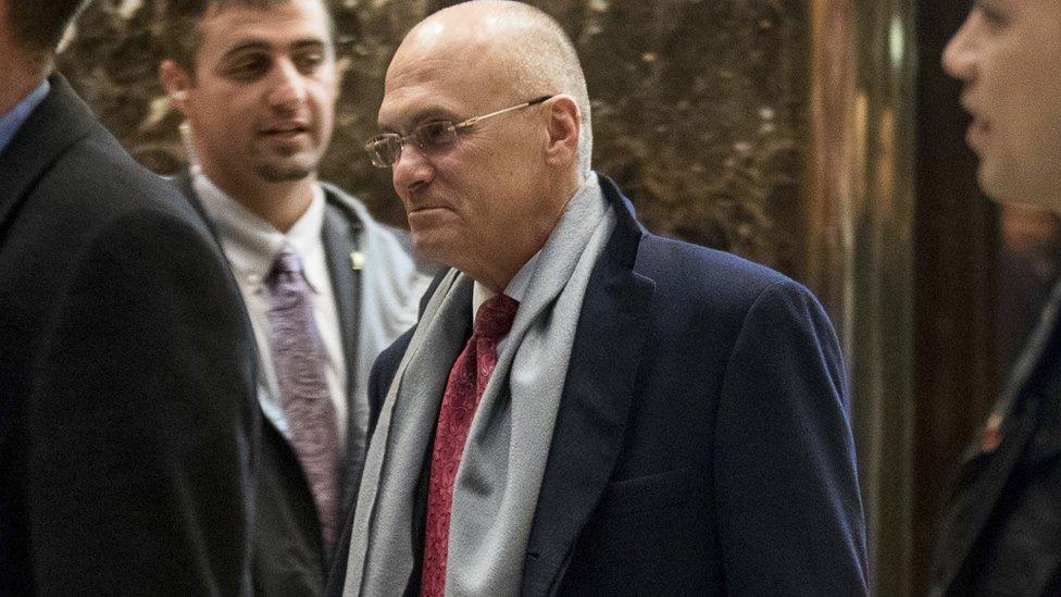 Andrew Puzder, (C), departs Trump Tower on Wednesday 7 December 2016