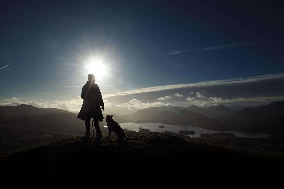 A fell walker enjoys the panoramic views from on top of Latrigg in the Lakeland Fells on December 4, 2009 in Keswick