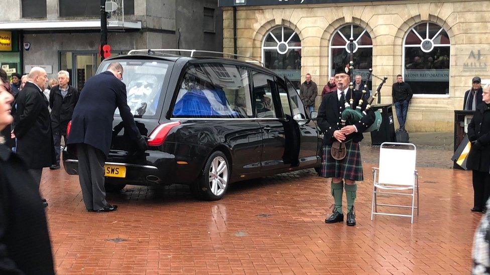 Funeral cortege and piper