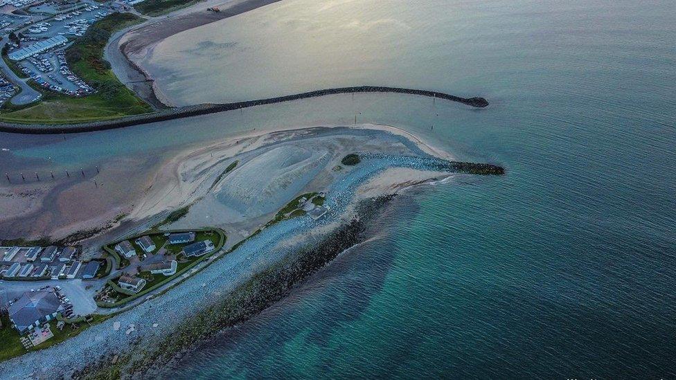 The aerial shot showing the harbour looking a lot like a dolphin