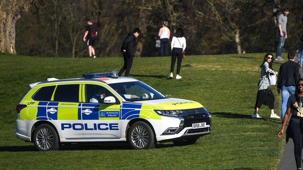 A police car is seen patrolling Greenwich Park on April 5, 2020 in London, England