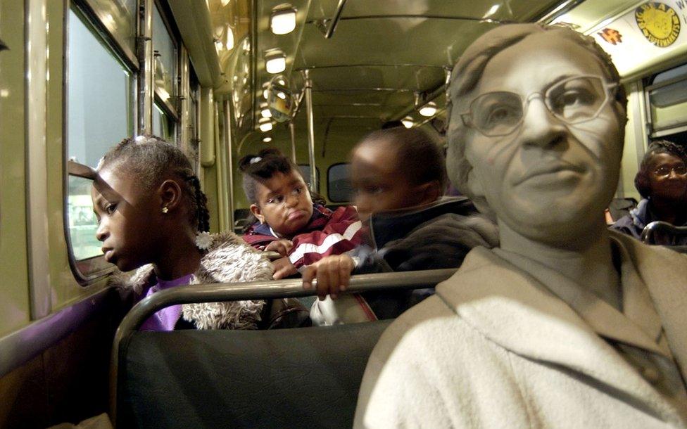 Children next to a bust of Rosa Parks at the National Civil Rights Museum in Memphis, Tennessee