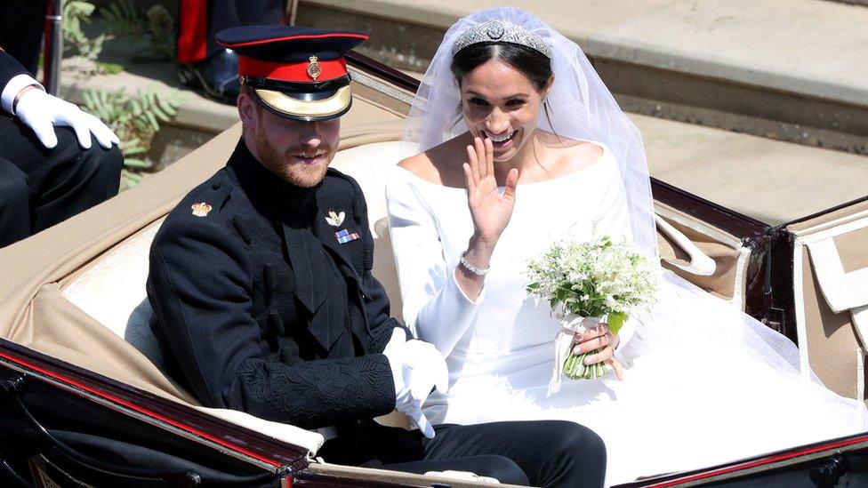 Prince Harry and Meghan Markle leave St George's Chapel in Windsor Castle after their wedding