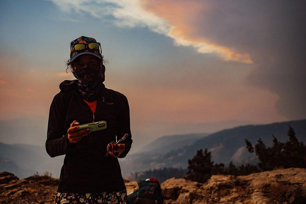 Hiker in Sierra National forest amid a wildfire