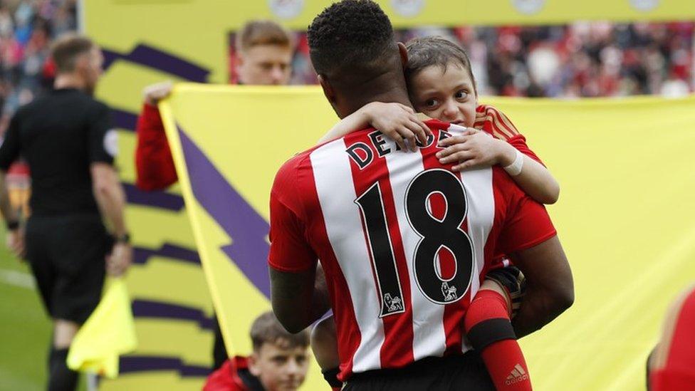 Jermain Defoe with Bradley Lowery