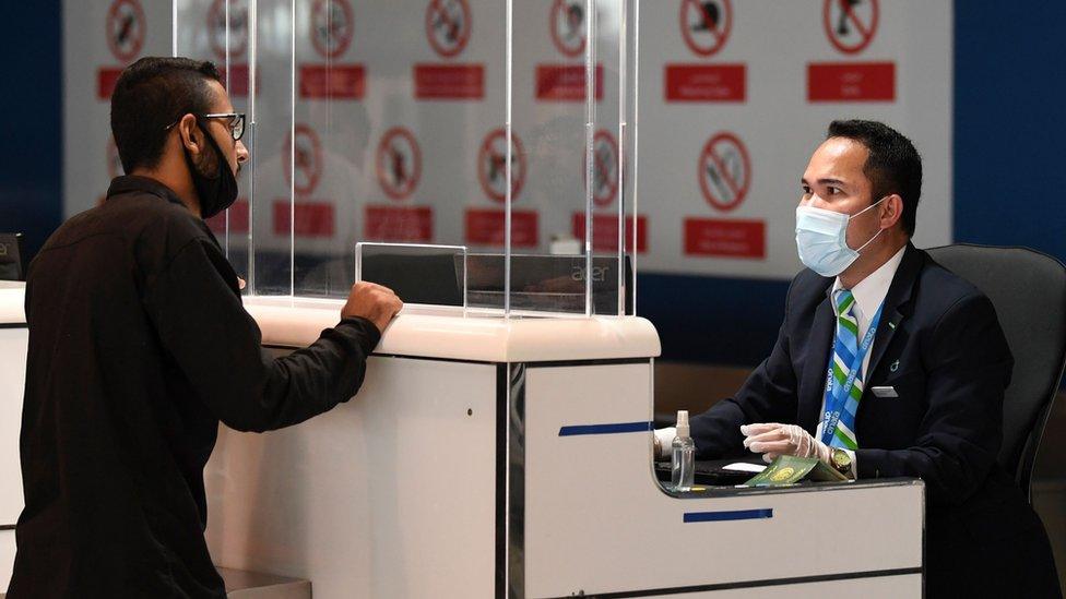 A Pakistani man checks in for a repatriation flight at Dubai's international airport on 7 May 2020