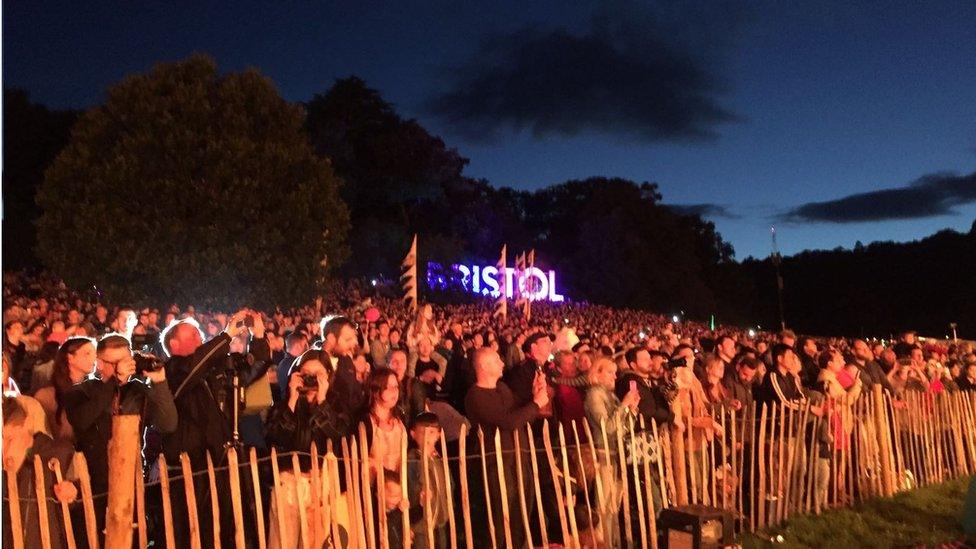 Crowd watches night glow