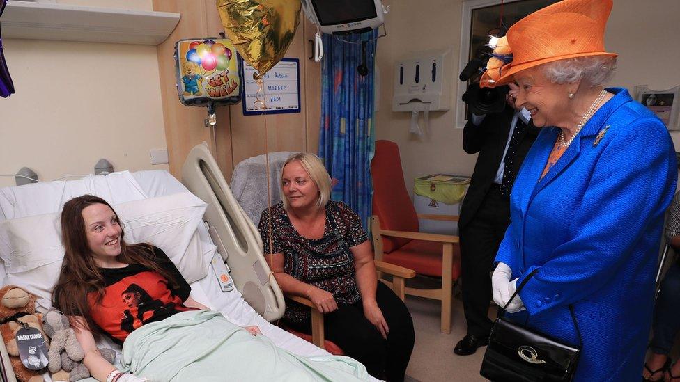 The Queen speaking to Manchester attack victim Millie Robson and her mother, Marie, during a visit to the Royal Manchester Children's Hospital