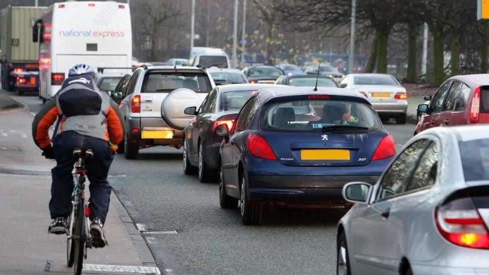 Cyclist and traffic in Manchester