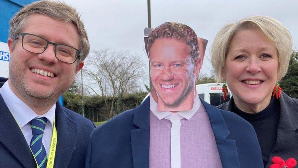 Cardboard cut-out of Lord Markham with protesters