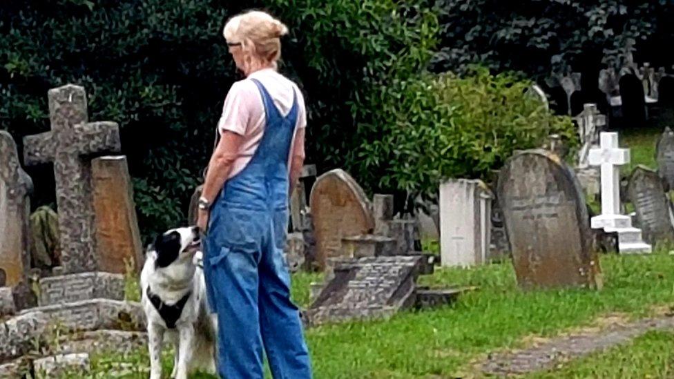 Ruth Hogan with her dog in Bedford cemetery