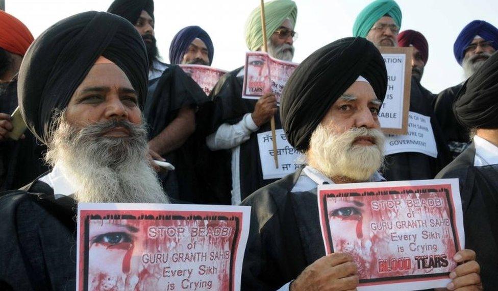 Sikh activists hold placards during a protest over an alleged desecration of the Sikh holy book, in Amritsar, India, 15 October 2015