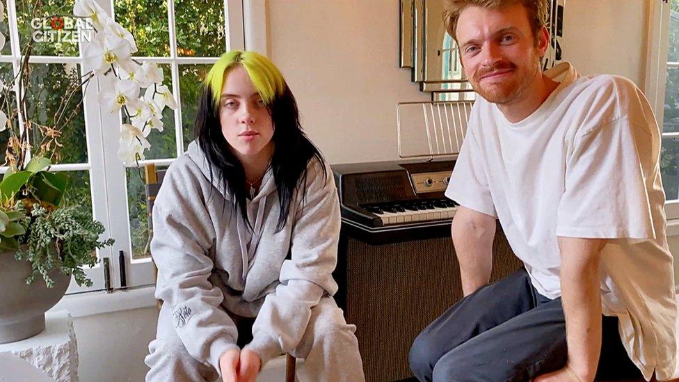 billie-and-her-brother-sat-by-piano