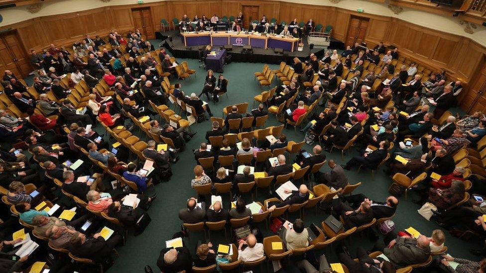 Members of the church listen to speakers at the general synod