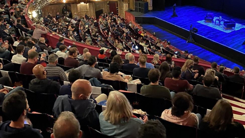 Audience members at a Q&A with football manager Arsene Wenger on Monday