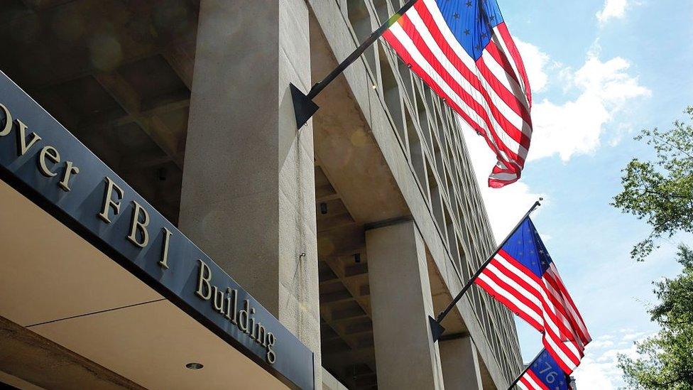 The FBI headquarters in Washington DC pictured with US flags