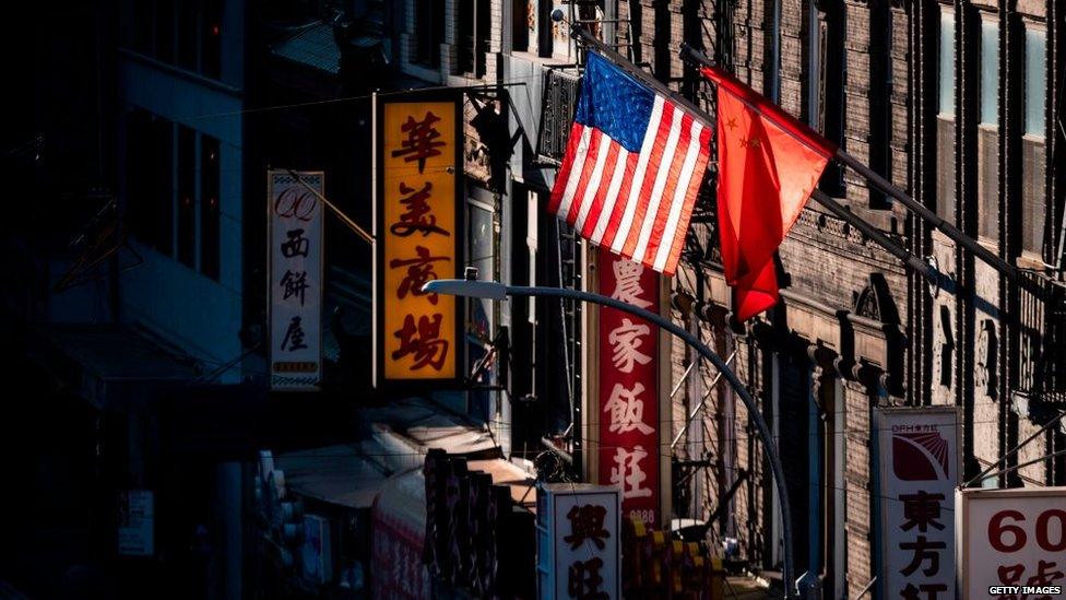 The PRC flag flies next to the US flag in Manhatten's Chinatown