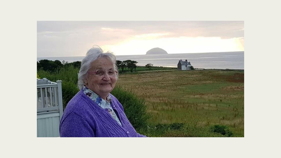 Kathleen Waugh sitting outside her holiday home near Girvan, Scotland.