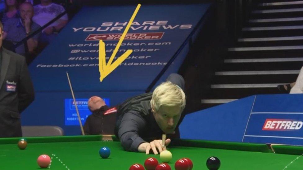john-higgins-looking-up-at-TV-screen.